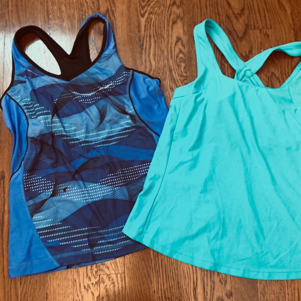 Barely used fitness tops with built in bra. Size L